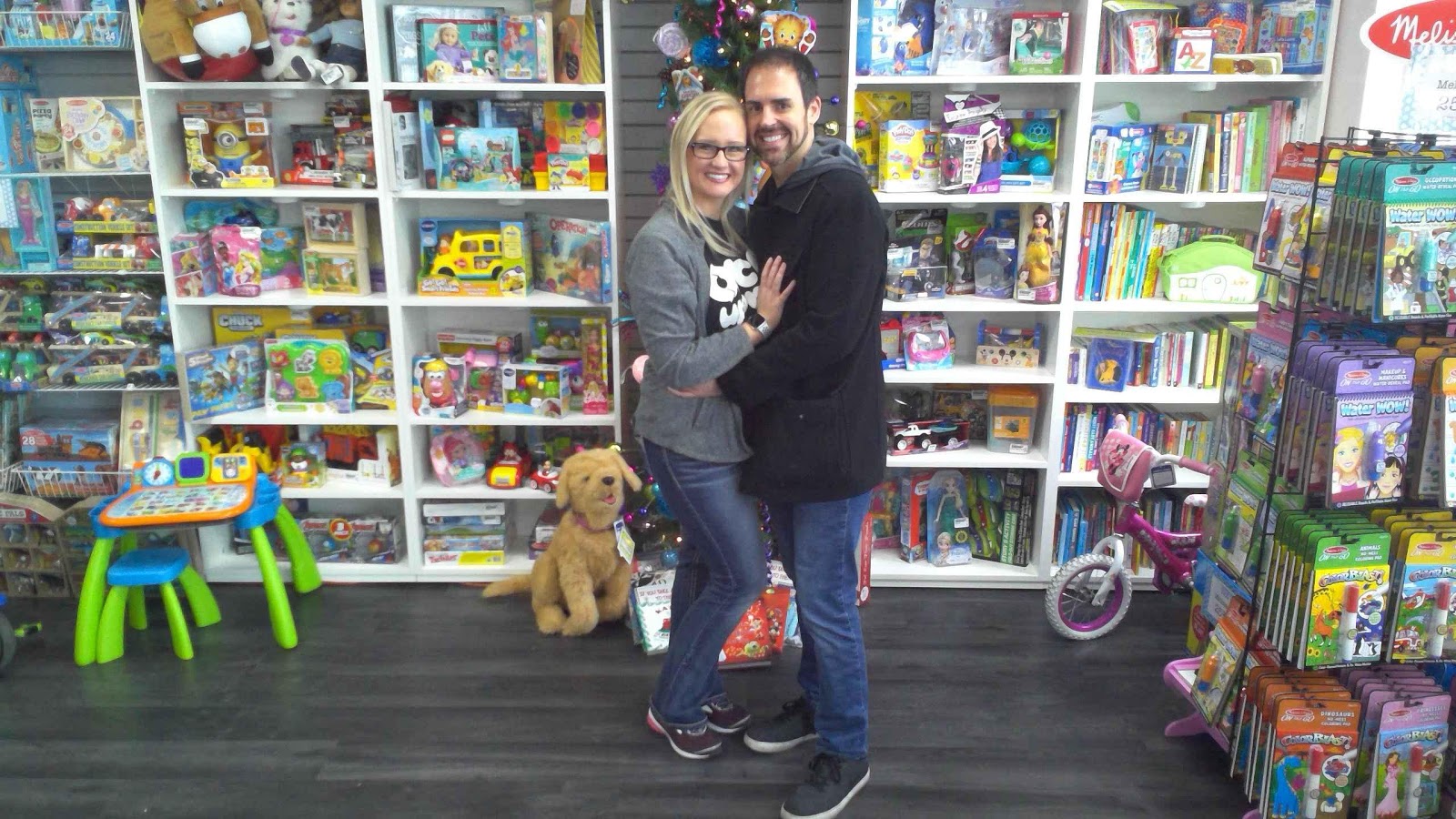 two people hugging in toy store