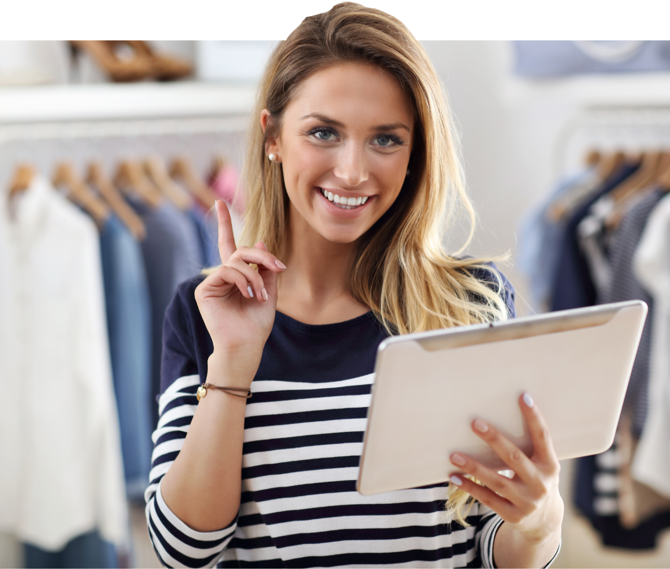 Woman holding a tablet in a clothing store
