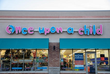 Once upon a child sign on building