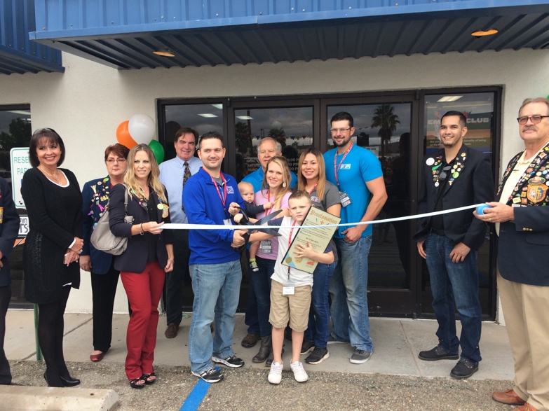 Ribbon cutting ceremony for new franchisees, Justin and Alysha 