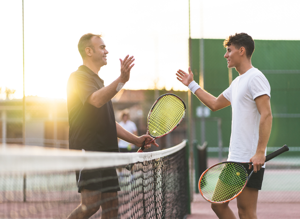 two men playing tennis