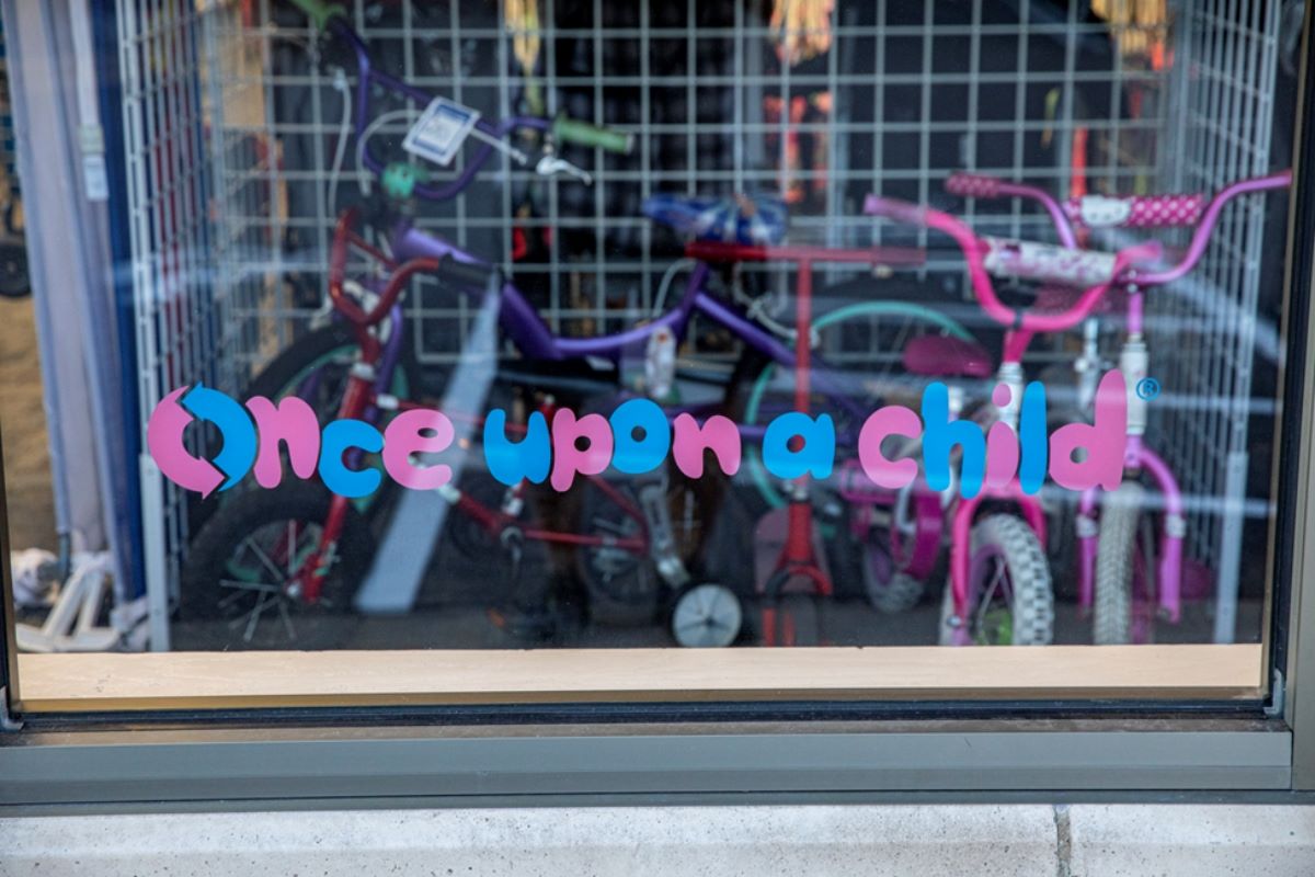 once upon a child logo on a store window