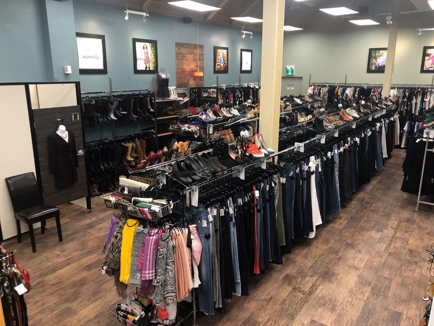 clothing and shoe racks in a store